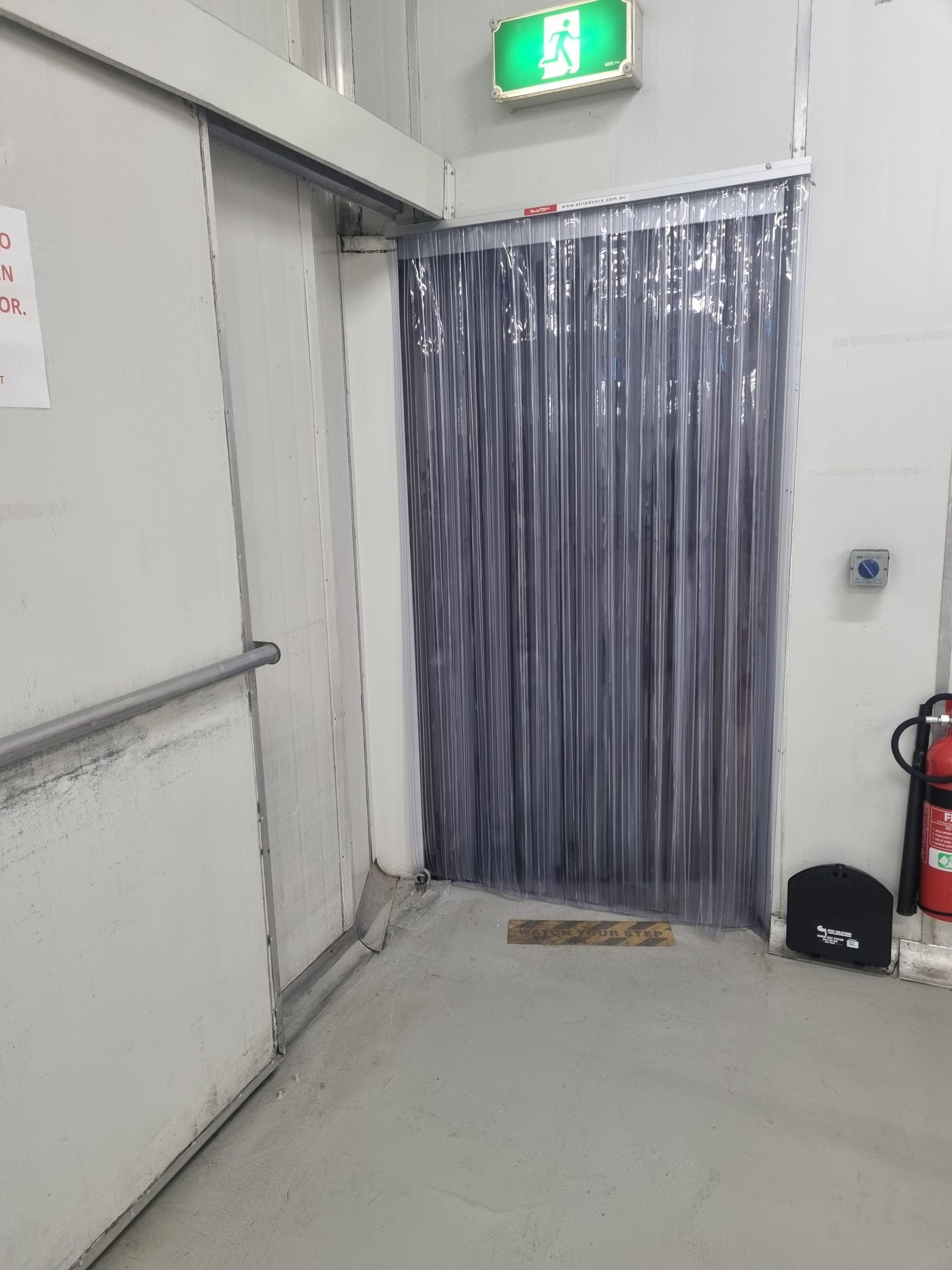 Smoke PVC strip curtain fitted to an internal doorway in a food handling area